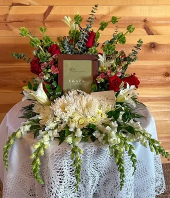 Memorable Moments Frame -Hand Crafted and Delivered by your Local Florist in LaPorte County, Country Charm Floral and Gifts. Shop our Impressive Selection of Sympathy and Funeral Flower Arrangements, Memorials, and Tributes to Show Your Respect for a Lost Loved One. Local Delivery Directly to Funeral Homes and Churches.