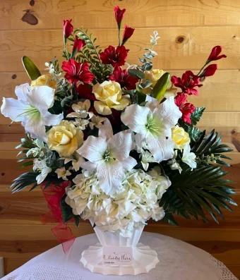 Traditional Church Silks arranged beautifully in an Urn Container. Our Sympathy Silks are realistic & life-like flower arrangements that are meant to last for years. From Sympathy Silk bouquets to Cemetery Silk Decorations, you will be satisfied with your purchase. Country Charm Floral and Gifts delivers Sympathy Silks, Funeral Flowers, and Sympathy Gifts quickly to local Funeral Homes & Churches in LaPorte County & New Carlisle, IN.