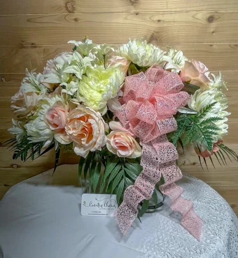 Pastel Cemetery Saddle is a stunning silk arrangement meant for your loved one's headstone/cemetery/gravesite. Country Charm Floral and Gifts only uses the most realistic and lifelike silk flowers and guarantees they will last through UV and weather exposure. Have our Sympathy Silks and Cemetery Headstone Saddles delivered today in LaPorte County & New Carlisle, IN.