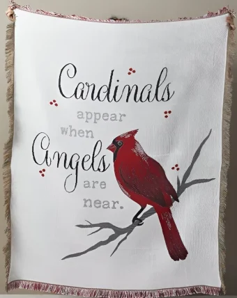 Wrap your loved ones in warmth and solace with our Sympathy Tapestry Cardinals Appear Blanket. Measuring 60" x 50", this generously sized blanket is imprinted with the heartfelt phrase 'Cardinals Appear When Angels Are Near,' accompanied by a beautiful image of a Cardinal perched on a tree branch. Find the best Sympathy gifts and Keepsakes at Country Charm Floral and Gifts delivering every day throughout Michigan City, Westville, New Carlisle, Rolling Prairie, and LaPorte County, IN.