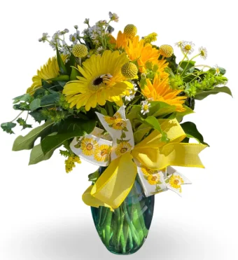 Looking for a gift for your Queen Bee or Someone who loves Sunflowers? Look no further than our Queen Bee Bouquet made with Fresh Sunflowers and the cutest bumblebees placed throughout- it's sure to make your loved one's day special! Send this vibrant Queen Bee Bouquet as a birthday or anniversary gift, we provide fast, same-day delivery at Country Charm Floral and Gifts to all addresses in New Carlisle, Hudson Lake, Rolling Prairie, Mill Creek, Union Mills, Fish Lake, Kingsbury, Michigan City, and LaPorte County, IN. Call or Order flowers online today!
