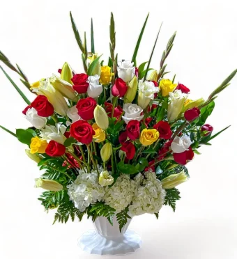 Our Timeless Tribute Arrangement is an Extra-Large Fresh-Flower Urn, commonly displayed during a Funeral Service or Church Setting. This Extra-Large Arrangement contains only the Freshest Roses in shades of Red, Yellow, and White, Crisp White Lilies, Hydrangea, and Gladiolus. Country Charm Florist Delivers to all Local Funeral Homes and Churches throughout New Carlisle, Rolling Prairie, and LaPorte County, IN. 7 Days a Week.