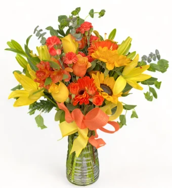 Burst of Sunshine Bouquet | Fresh Orange & Yellow Lilies, Roses, Daisies, and Sunflowers to Bring Sunshine, Warmth, and Happiness to Any Day, for Birthdays and Good Vibes! Daily Local Delivery to New Carlisle and LaPorte County, IN.