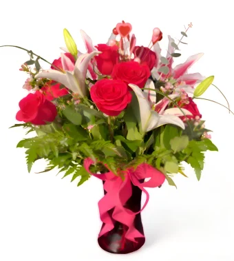Hot Pink Romance; A Gorgeous Valentine's Day Bouquet Bursting with Hot Pink Roses and Lily Stargazers in a red glass vase. Make Her Valentine's Day Perfect with one of our Hand-Arranged Fresh Flower Arrangements by Your Favorite Local Flower Shop- Country Charm Floral & Gifts in Rolling Prairie, IN. Local Delivery 7 Days a Week.