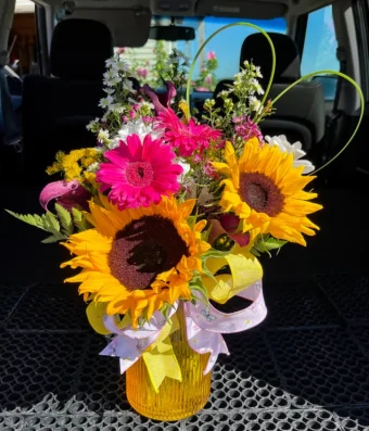 Sunflowers and Daisies: A vibrant fresh flower arrangement of Bold Sunflowers paired with Blooming Vibrant Gerbera Daisies will surely make your recipient's day, whether it be a Birthday Surprise or a heartfelt Anniversary Bouquet. We will deliver as fast as today throughout LaPorte County and New Carlisle, Indiana.