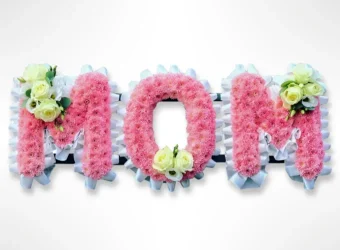 Mom Funeral Flower Letters: Pay Tribute to a Wonderful Mother/Woman with our Mom Funeral Flower Letters. This beautiful fresh floral tribute proudly spells "MOM" and is arranged with only premium, fresh-cut flowers. Optionally display this tribute lying flat, or upright with our optional support stands. Order this statement piece for any Funeral Service or Visitation 7 days a Week throughout LaPorte County, Indiana and New Buffalo, Michigan.