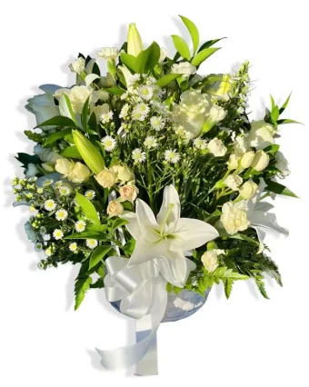 Heavenly Comfort Floral Basket: A Beautiful and Large Arrangement of Premium, Fresh-Cut Flowers in Hues of White, Presented in a Tasteful White Basket. This is a wonderful comfort gift to send to any Memorial Service, Viewing, Celebration of Life, or a Loved One's Home. This stunning display speaks for itself, with its Heavenly white hues, it will surely bring comfort to those who need it most. Best Florist for all Occasions, Specializing in Funeral Arrangements, Delivering 7 Days a Week to LaPorte County & New Carlisle, Indiana and Berrien County, Michigan.
