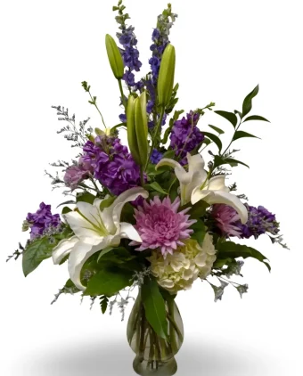 Neverending Love Bouquet: A Tasteful and Stunning Gesture of Love and Comfort to Those Who Need It Most, in the Form of a Premium Fresh Flower Arrangement in Purple and White Hues. Not only is this a perfect Sympathy Bouquet, but its beautiful color scheme of romantic purple and fresh white flowers makes for a lovely anniversary or get well soon arrangement. Send this to any home, business, or funeral home throughout LaPorte, Indiana and Berrien County, Michigan with our Affordable, Fast, and Reliable Flower Delivery 7 Days a Week- Country Charm Floral & Gifts; Rolling Prairie, Indiana Florist Shop.