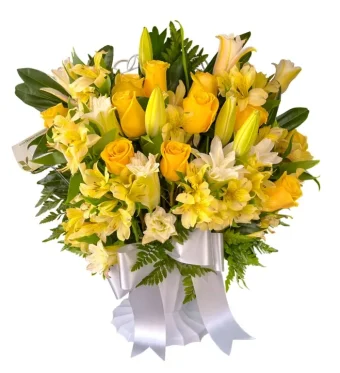 Radiant Remembrance Basket: A fresh flower arrangement of vibrant yellow and white premium flowers, arranged beautifully in an urn style vase/container. This is a suitable arrangement for sending your condolences, comfort, and reminding your recipient that they are not alone- even during a difficult grieving process. Local delivery to all funeral homes, churches, and homes 7 days a week to LaPorte County and New Carlisle, Indiana and New Buffalo, Michigan.