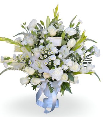 Order our At Peace Funeral Basket of Fresh, Premium White Flowers including Lilies, Roses, and Carnations in an urn-style container. We provide top quality flower arrangements to send to a Funeral Service, Viewing, Celebration of Life, or Home for local delivery directly to Funeral Homes in LaPorte County & New Carlisle, Indiana | Country Charm Floral and Gifts located in Rolling Prairie, IN.