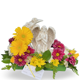 Illuminate your garden or memorial space with the Solar Moon Garden Angel, a beautifully crafted angel figurine designed to bring peace, warmth, and remembrance. This delicate solar-powered angel statue rests gracefully within a crescent moon, radiating a soft, golden glow that symbolizes eternal love and guidance. Presented in a fresh flower arrangement of premium-quality blooms, this serves as a meaningful and tasteful Sympathy Gift to send to any Funeral Service, Celebration of Life, or Loved One's Home- leaving your recipient with a lasting memorial Angel Figurine to cherish for years to come.