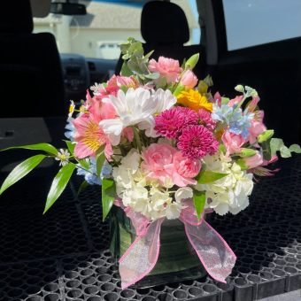 Our one-of-a-kind Cotton Candy Bouquet is a colorful, fresh floral arrangement of premium quality flowers in a tasteful square glass vase. This delightful combination of pink, white, yellow, and blue fresh flowers will surely make your loved one's day. Perfect Gift of Summer Flowers for Birthdays, Anniversary, or Just to Brighten Someone's Day. Fast, Local Delivery Daily to LaPorte, Indiana.