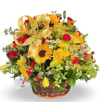Friendship Basket full of Vibrant Sunflowers along with beautiful Red Roses and Carnations, presented in a tasteful wicker basket. This Friendship Basket is a perfect gift for sending condolences, showing your love, or just brightening up someone's day! Send this gorgeous fresh flower arrangement today, all throughout New Carlisle and LaPorte County, Indiana along with New Buffalo and Three Oaks, Michigan- 7 days a week!