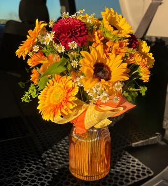 Country Sunset Bouquet | Whether you're looking to brighten someone's day, celebrate a special occasion, or send a heartfelt gesture of love, this bouquet delivers a burst of sunshine and joy. With its bold colors and rustic charm, the Country Sunset Bouquet brings a touch of the season’s natural beauty into any space. Same Day Delivery 7 Days a Week to LaPorte, Indiana and New Buffalo, Michigan.