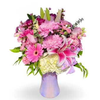 Make Her Day Bouquet- a stunning fresh flower arrangement that will surely be the highlight of your recipient's day. Arranged with only the best quality, fresh-cut flowers in a beautiful vibrant glass vase. The flowers included will typically consist of Lilies, Carnations, Gerbera Daisies, and Daisy Mums with Lush Greenery. Perfect for any occasion, especially Mother's Day, Birthdays, and Anniversaries. We provide delivery to any location within LaPorte County, Indiana and Berrien County, Michigan- You will definitely make her day with this bouquet!